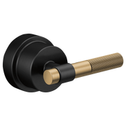 Matte black and luxe gold T-lever handle with textured grip and round escutcheon plate for pressure balance valve trim.