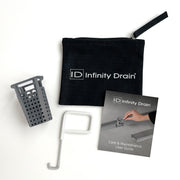 Black nylon pouch with Infinity Drain logo, gray perforated basket, white removal tool, and care instruction booklet.