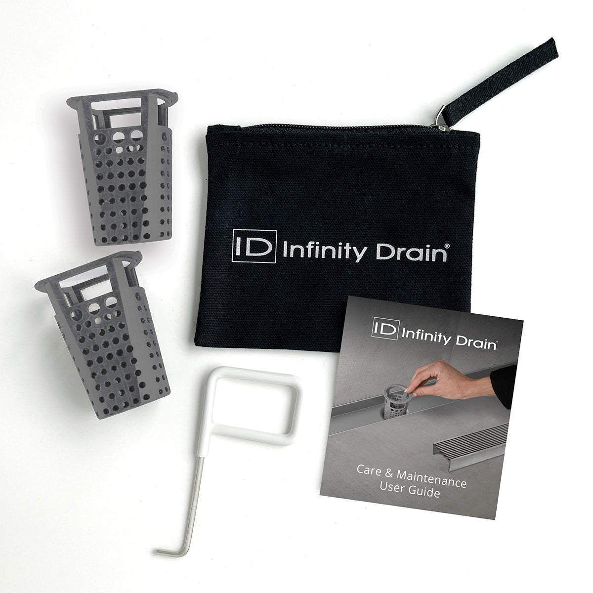 Two gray perforated baskets, white cleaning tool, black storage pouch, and care guide included in maintenance kit.
