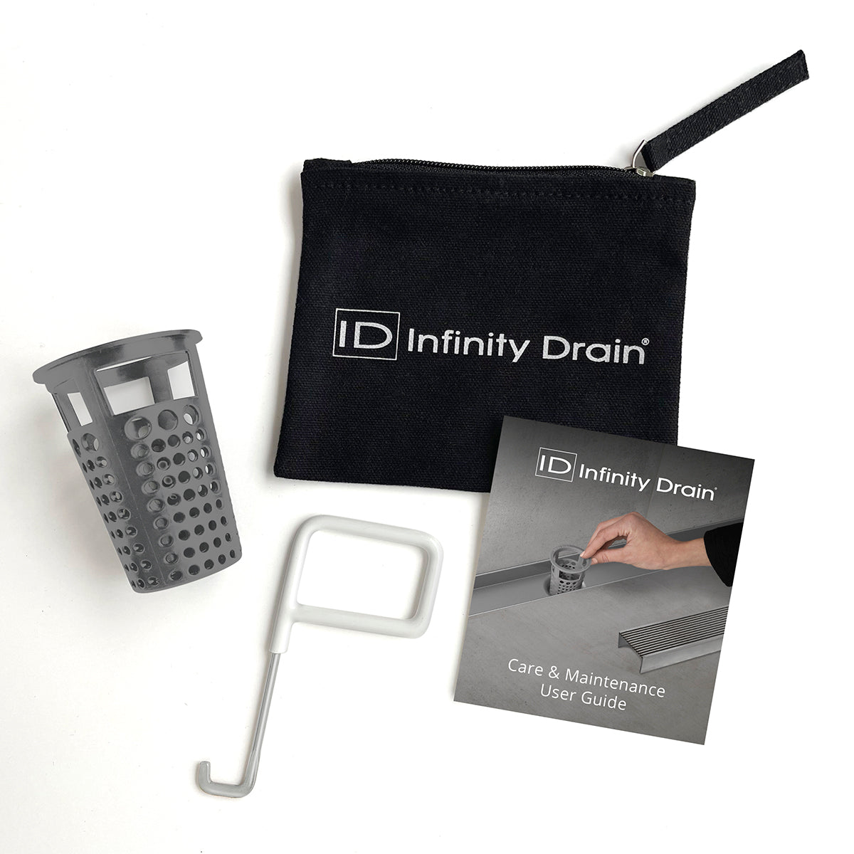 Infinity Drain maintenance kit containing gray strainer basket, white removal tool, black carrying pouch, and care guide.