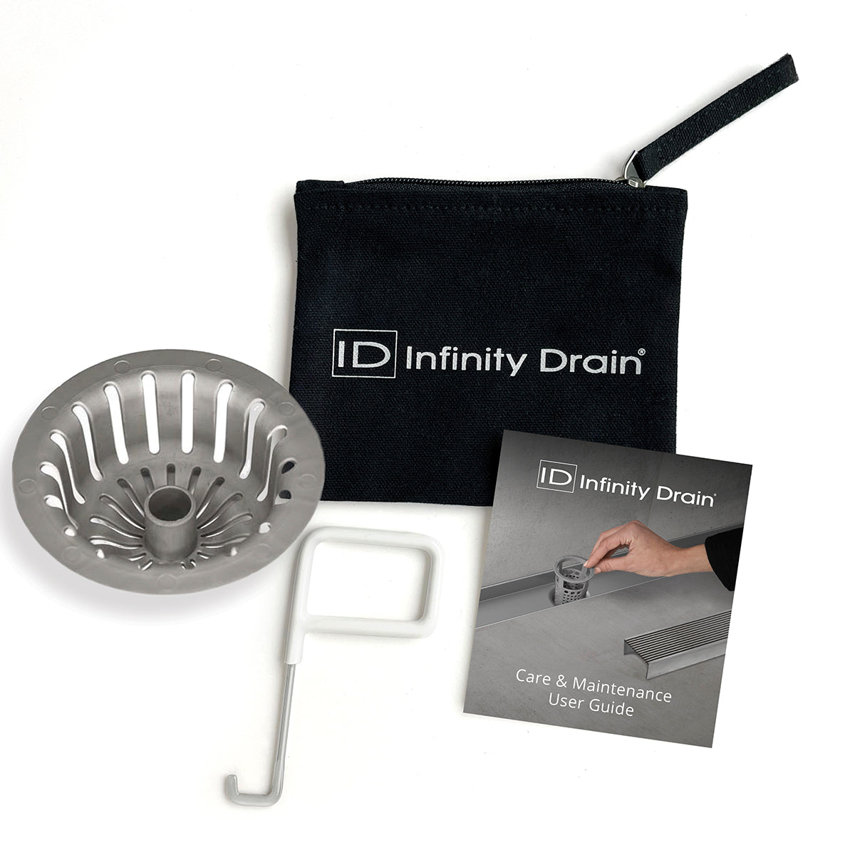 Infinity Drain hair maintenance kit containing metal strainer, white removal tool, black carrying pouch, and care guide.