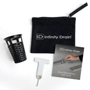 Black perforated strainer basket, white maintenance tool, black canvas pouch with handle, and care guide booklet.