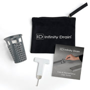 Infinity Drain maintenance kit containing gray perforated basket, white tool, black pouch, and instruction guide.