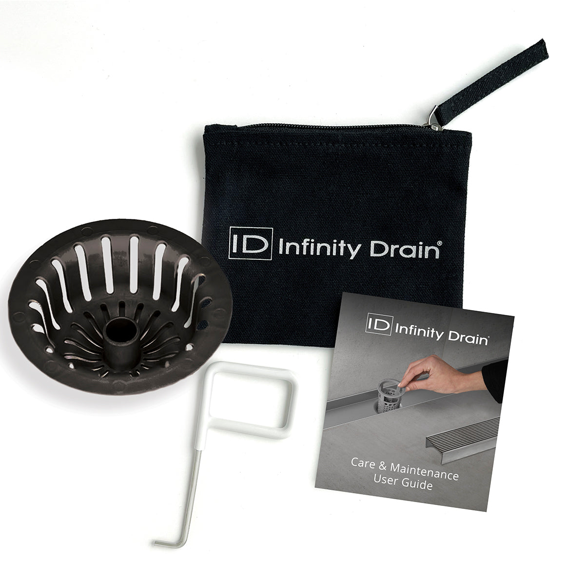 Black drain strainer with slotted design, white removal tool, black carrying pouch, and care instruction booklet.