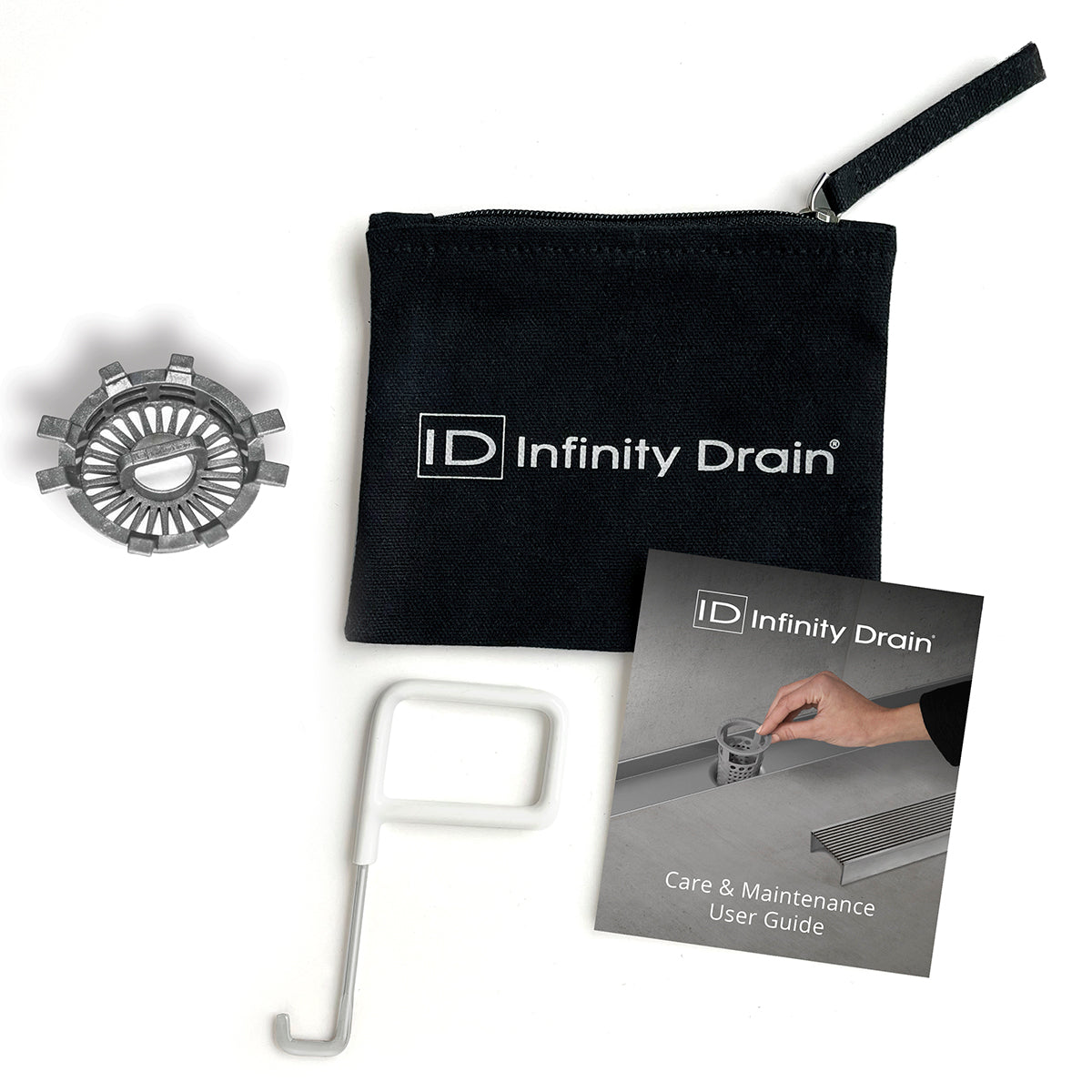 Infinity Drain HMK-T kit containing circular stainless steel grate, white removal tool, black carrying pouch, and care guide.