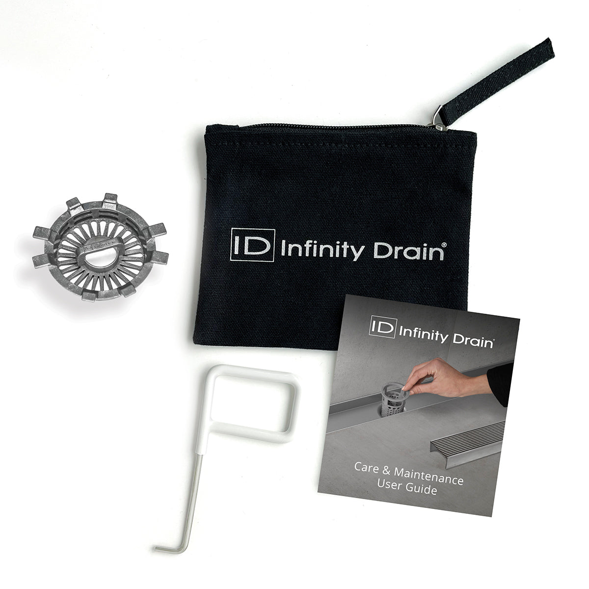 Infinity Drain hair maintenance kit with black carrying pouch, metal hair trap component, white removal tool, and care guide.