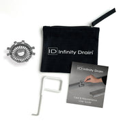 Infinity Drain hair maintenance kit with black carrying pouch, metal hair trap component, white removal tool, and care guide.