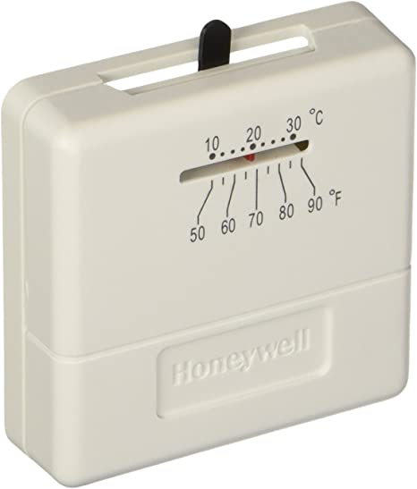 Honeywell square thermostat with analog dial displaying temperature scales in Celsius and Fahrenheit with black pointer adjus