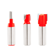 Three router bits with red cutting heads and silver 1/2" shanks arranged in a row.
