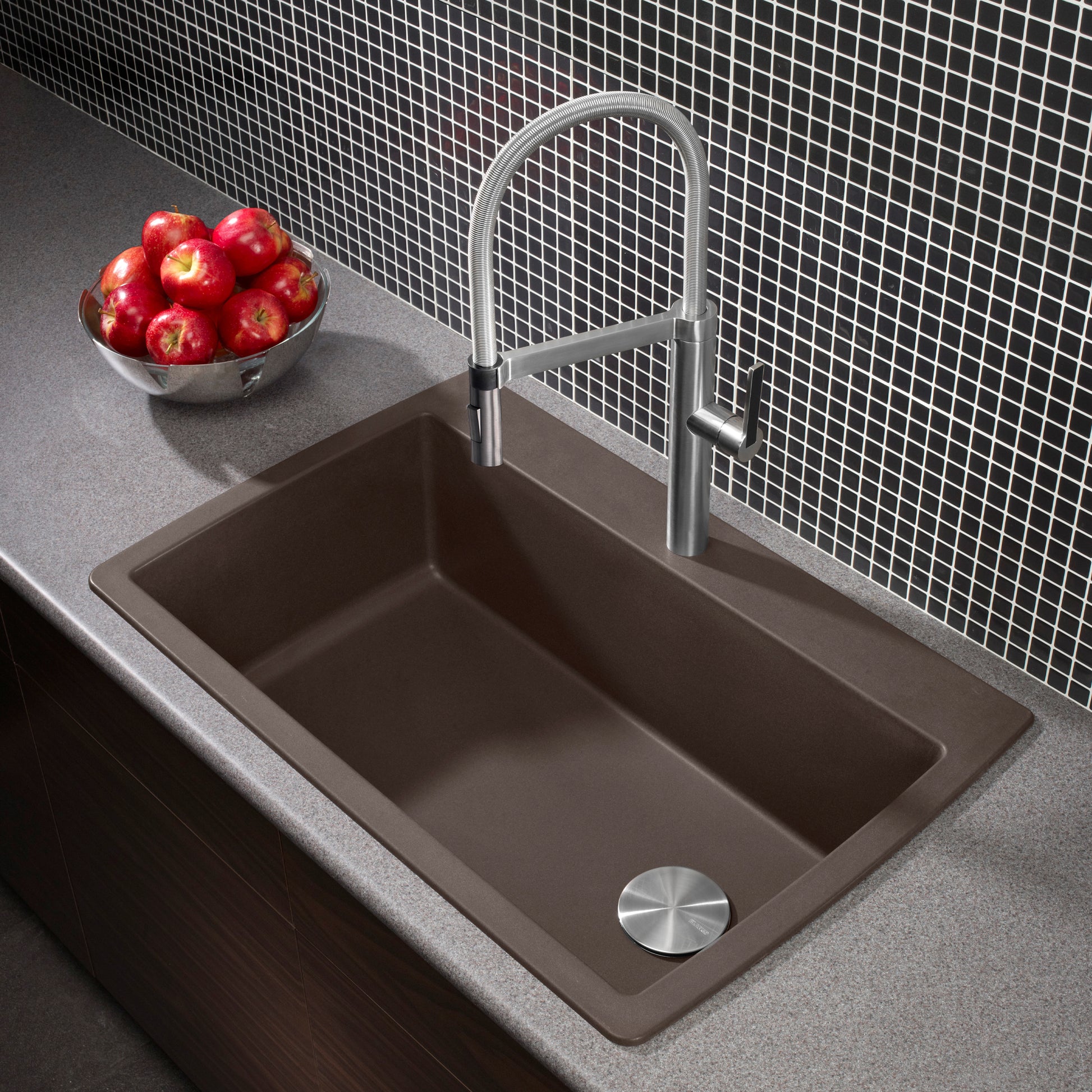 Cafe brown drop-in kitchen sink with single rectangular bowl and chrome pull-down faucet, installed in gray countertop.