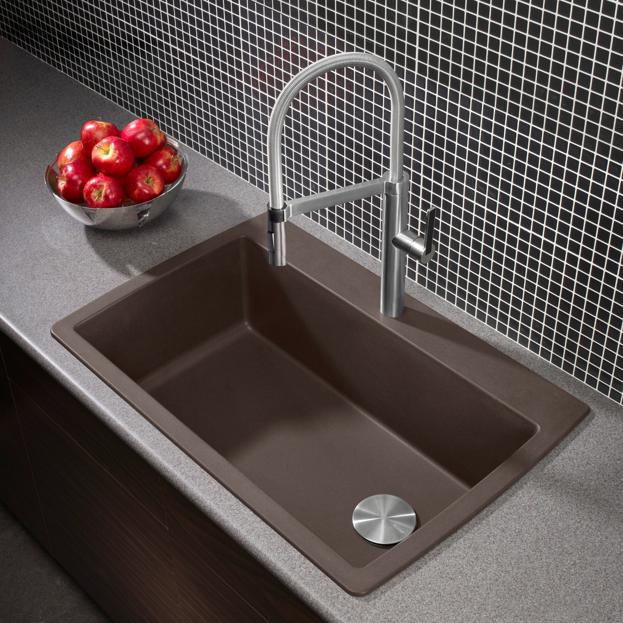 Cafe brown drop-in kitchen sink with single rectangular bowl and chrome pull-down faucet, installed in gray countertop.