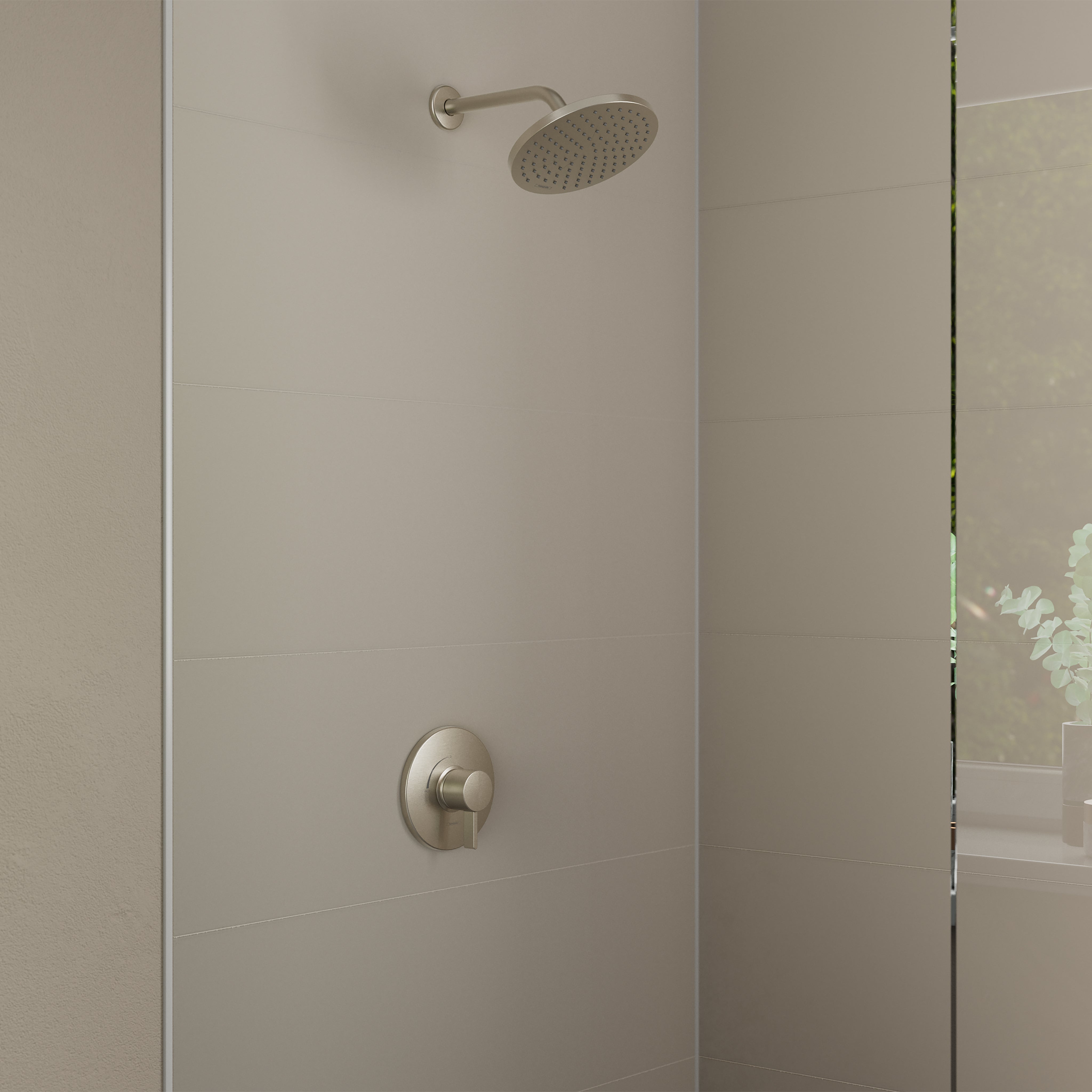 Brushed nickel shower set with round rainfall showerhead and wall-mounted pressure balance valve on tiled shower wall.