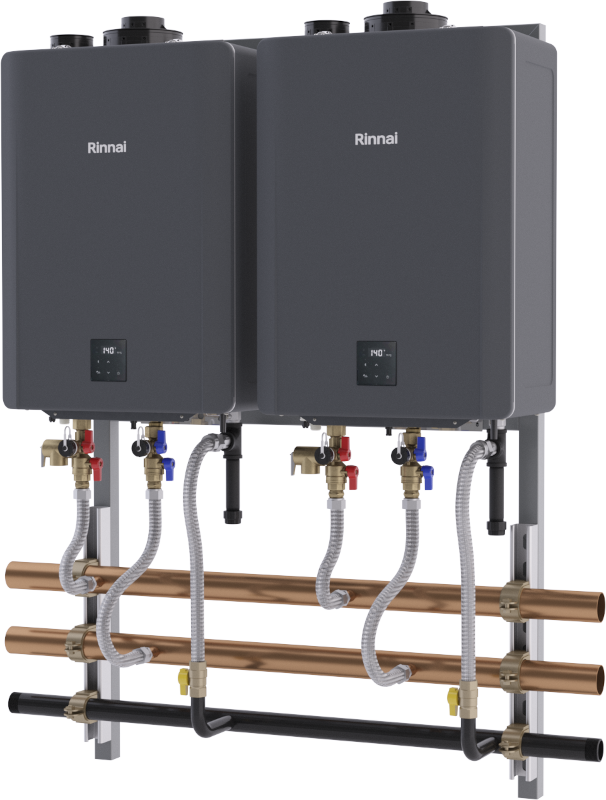 Two black Rinnai tankless water heaters mounted on a wall-hanging rack with copper pipes, brass fittings, and integrated pump