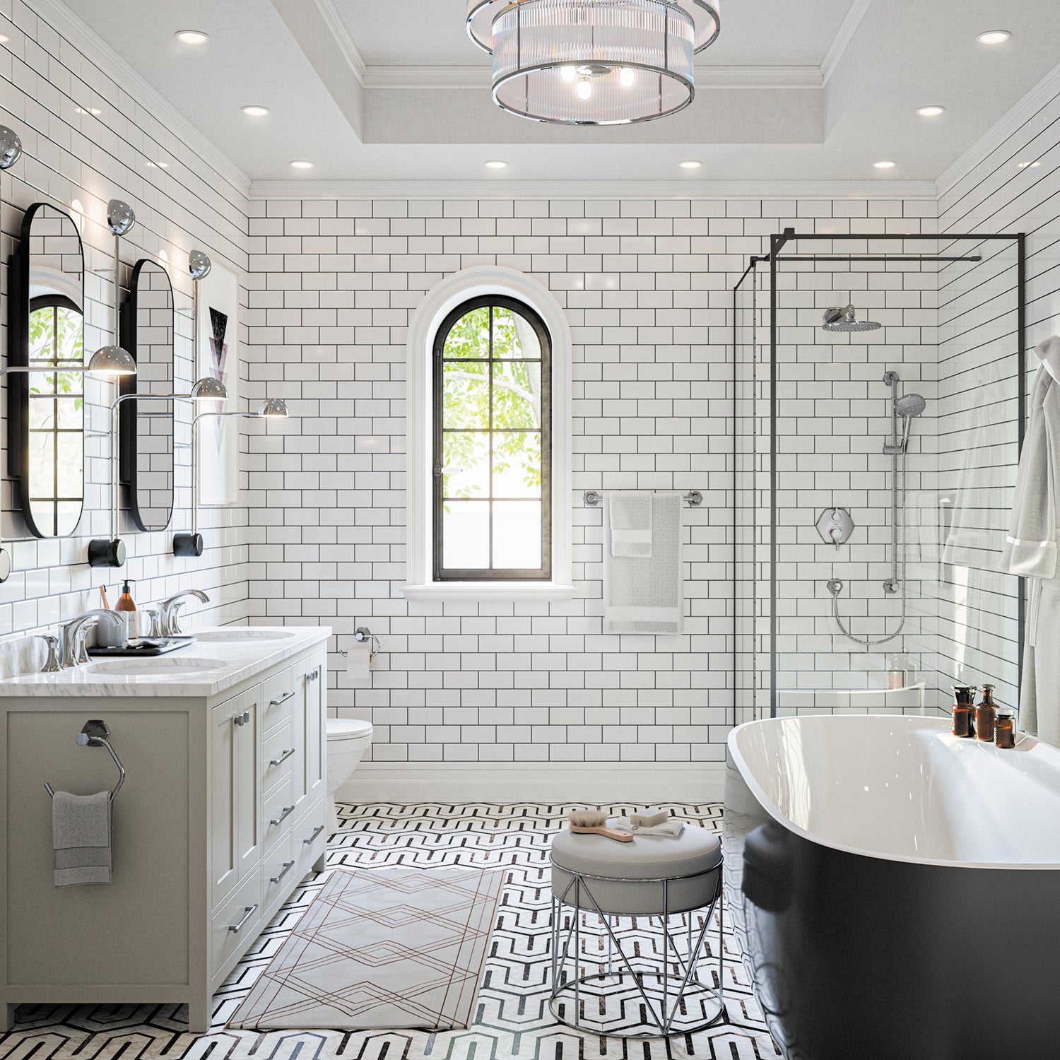 Chrome freestanding tub filler with curved spout and handheld showerhead mounted on white bathtub rim.
