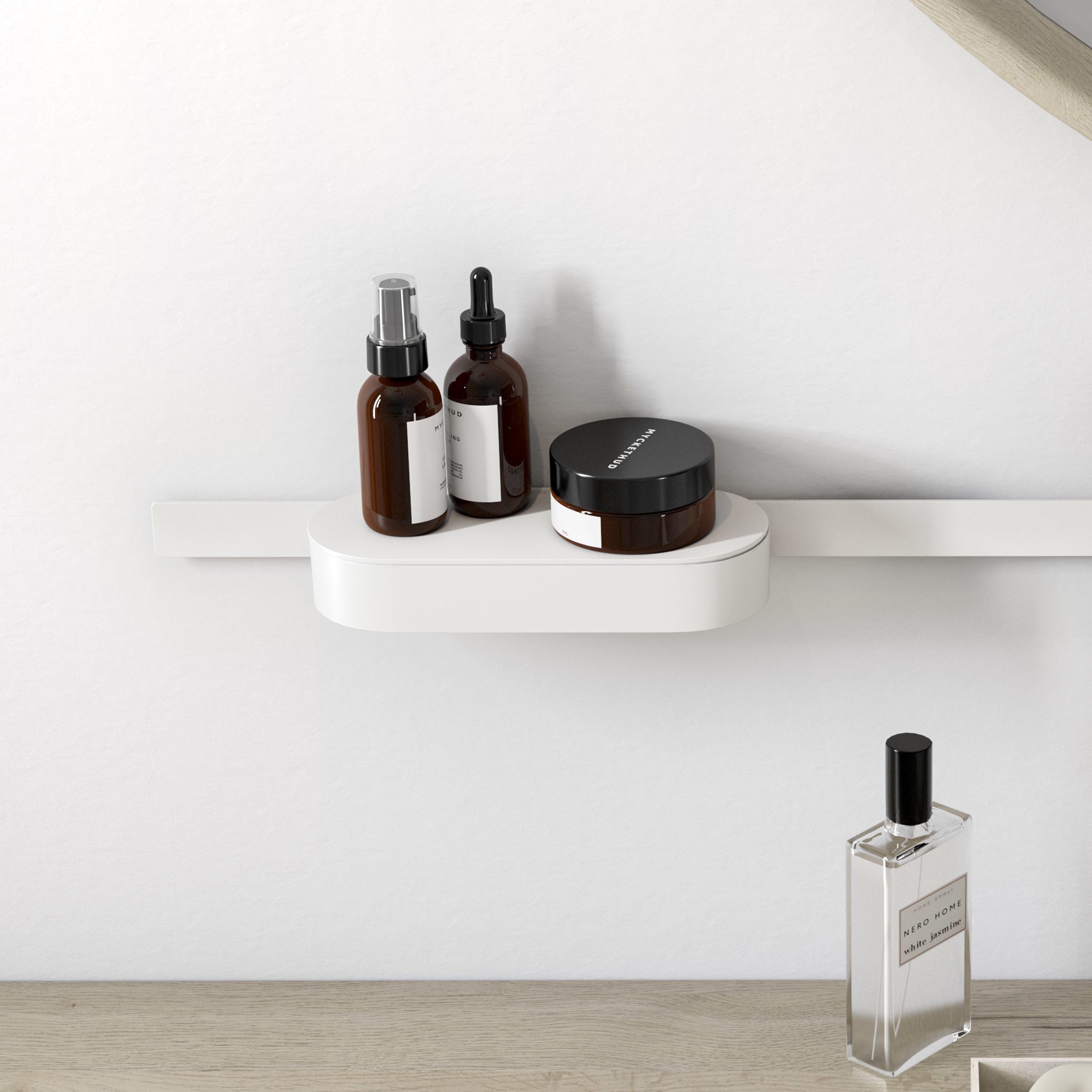 Matte white wall-mounted storage basket with cover holding brown glass bottles and a dark container.