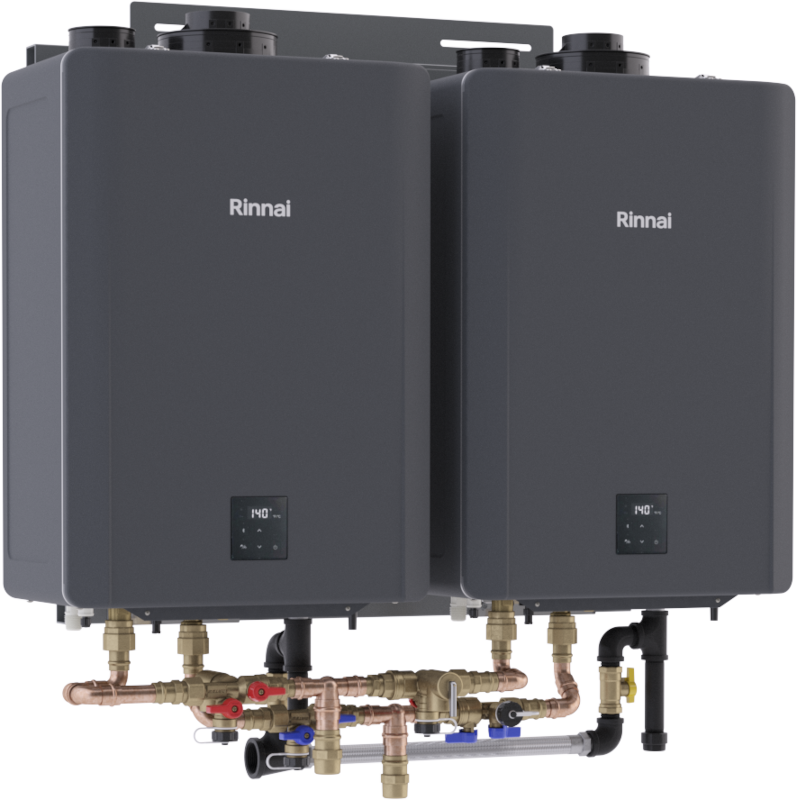 Two dark gray Rinnai tankless water heaters mounted on wall-hanging rack with copper piping and brass fittings below.