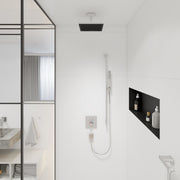Chrome ceiling-mounted shower extension pipe with black rectangular showerhead installed above white tile wall.