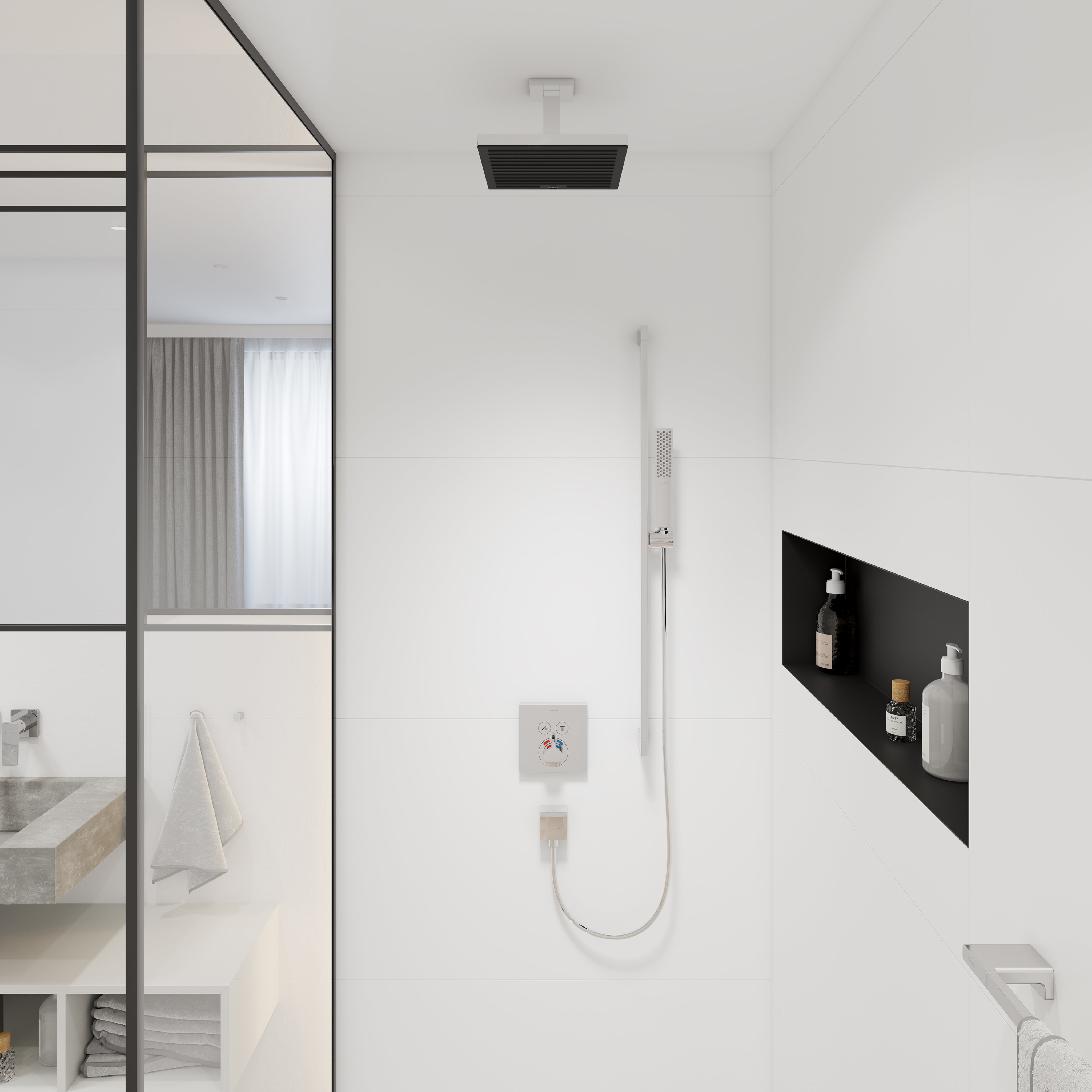 Chrome ceiling-mounted shower extension pipe with black rectangular showerhead installed above white tile wall.