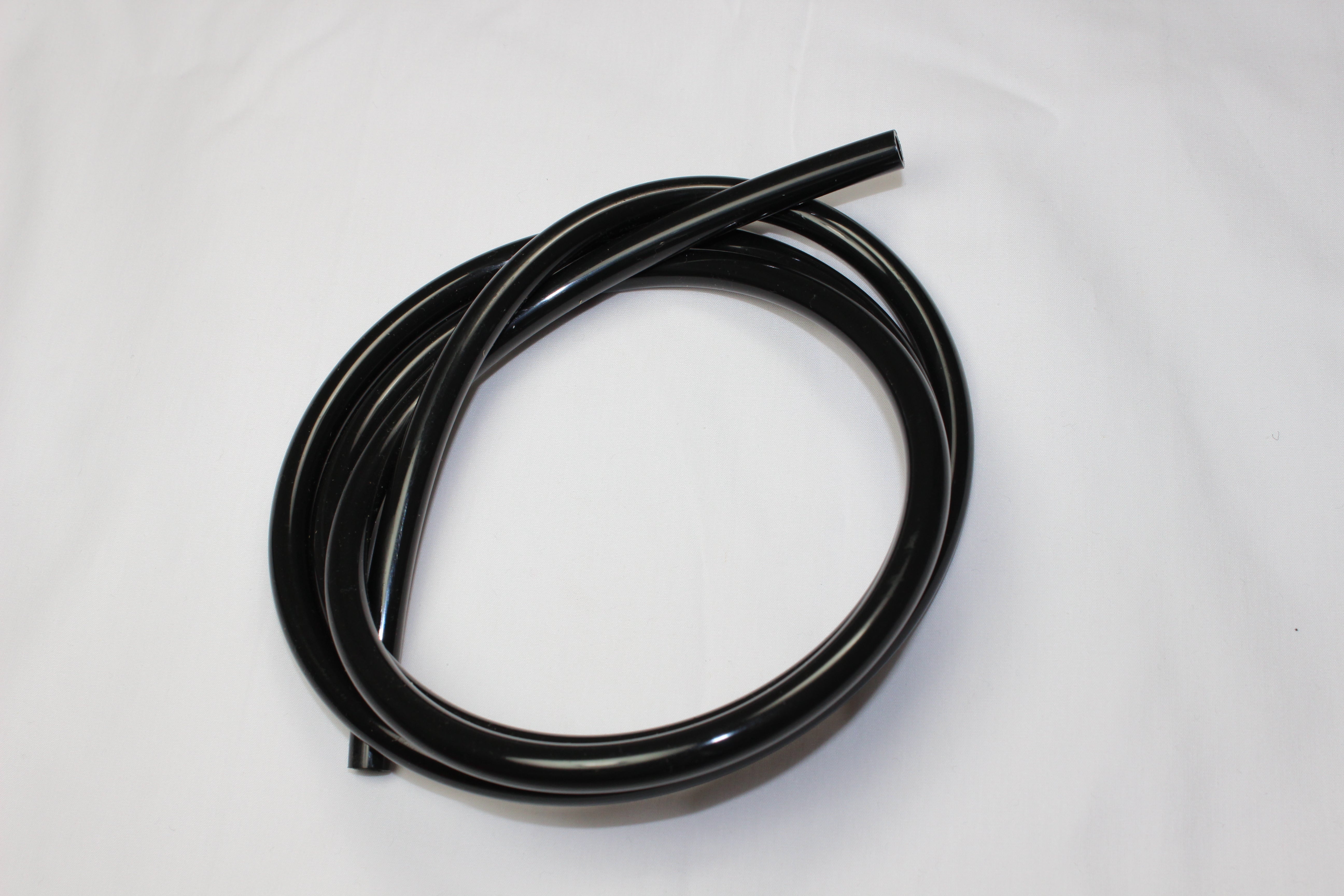 Black polyethylene tubing coiled on white background.