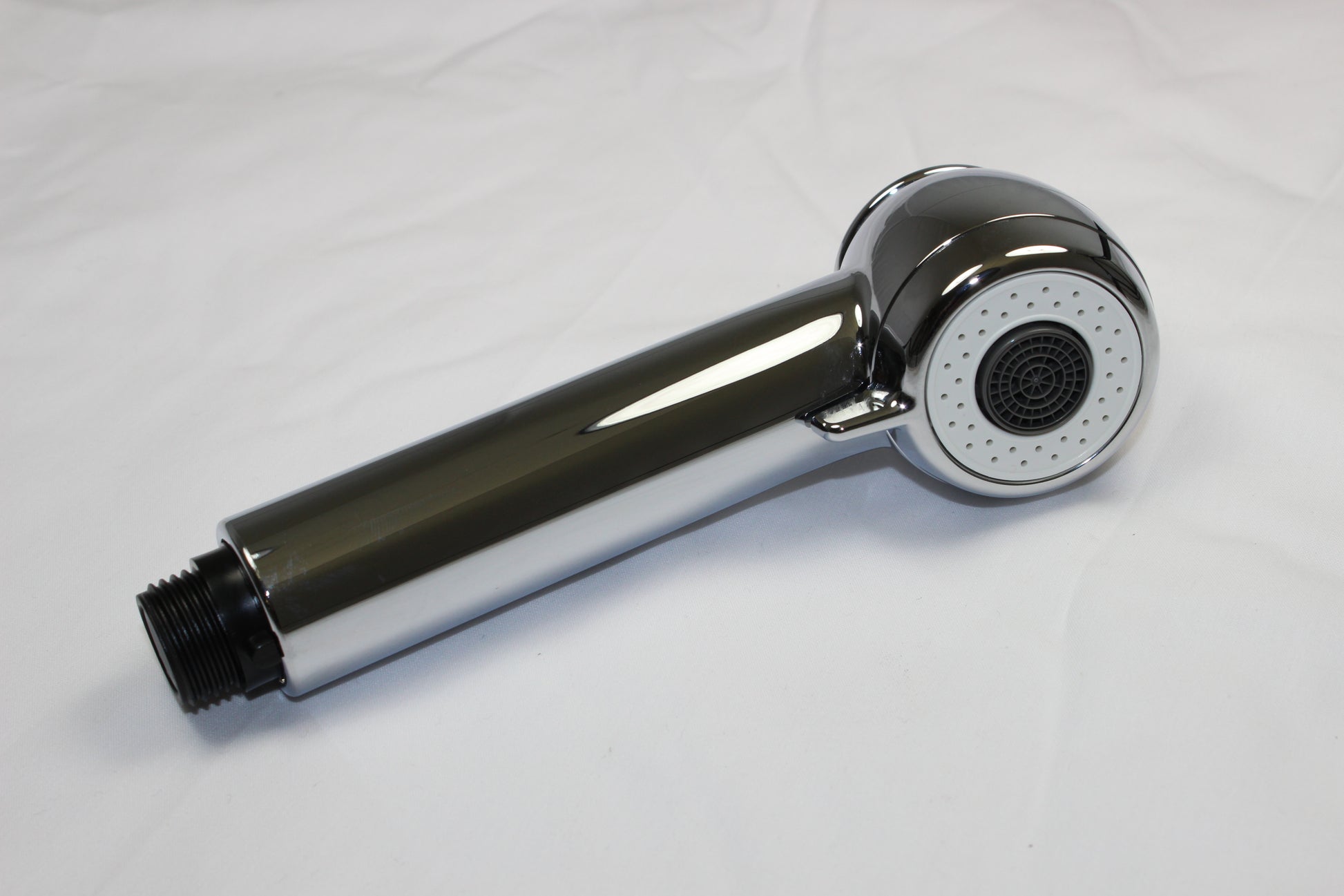 Chrome handheld shower sprayhead with round perforated faceplate and black grip handle attached to threaded connector.