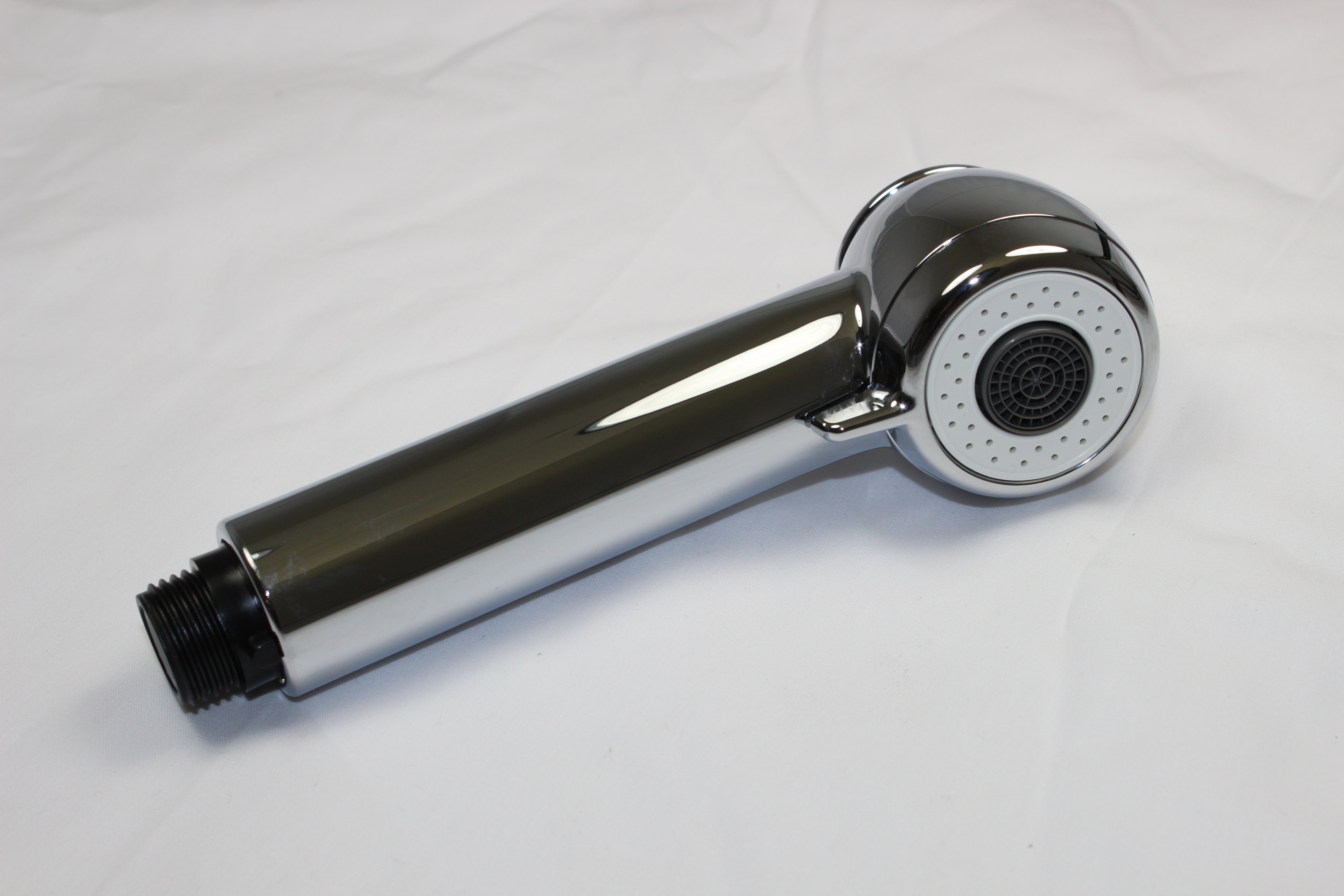 Chrome handheld shower sprayhead with round perforated faceplate and black grip handle attached to threaded connector.