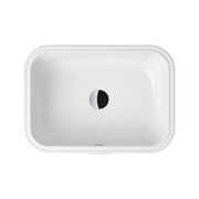 White rectangular under-counter basin with rounded corners and single drainage hole.