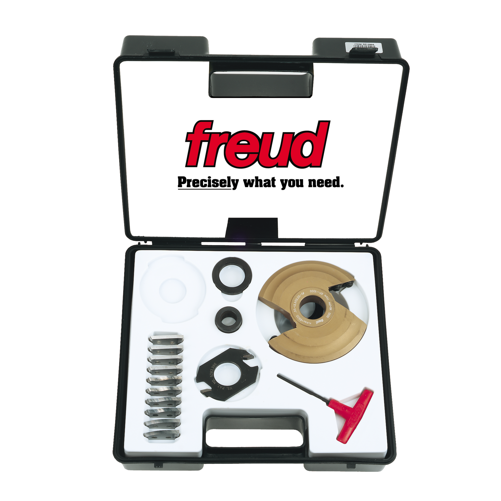 Black plastic Freud case containing tan and black router bit components, metal rings, spacers, and a red wrench tool.