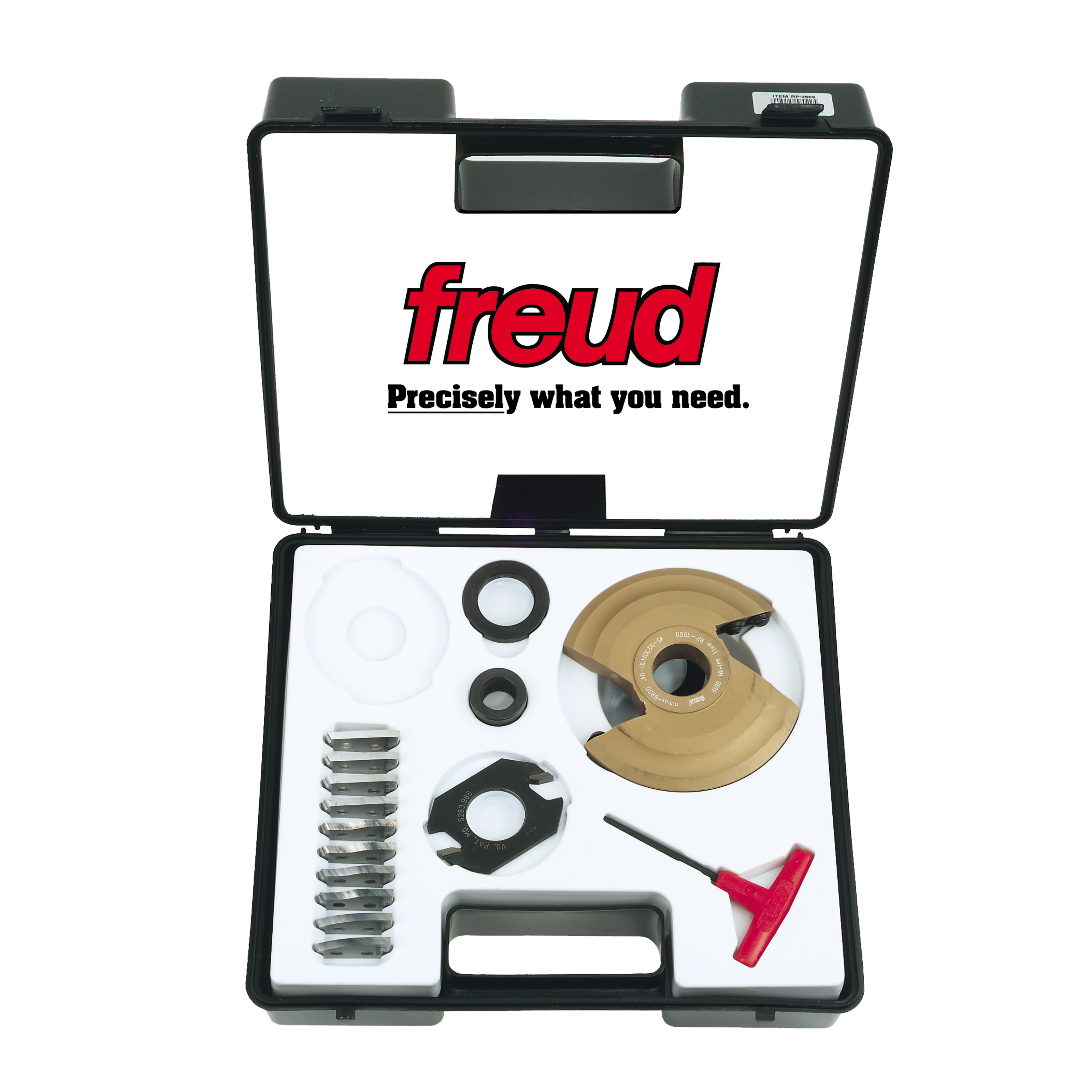 Black plastic Freud case containing tan and black router bit components, metal rings, spacers, and a red wrench tool.
