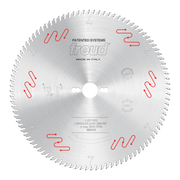 Circular saw blade with carbide-tipped teeth, center hole, and Freud branding on silver steel surface.