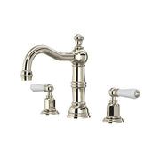 Polished nickel widespread bathroom faucet with curved spout, column-style center body, and white porcelain lever handles.