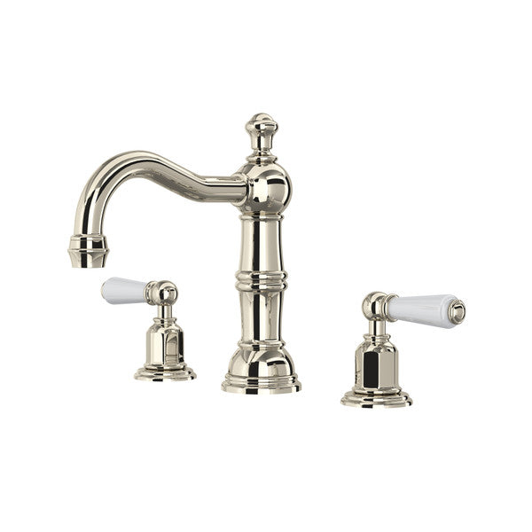 Polished nickel widespread bathroom faucet with curved spout, column-style center body, and white porcelain lever handles.
