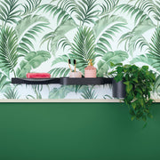 Matte black wall-mounted tumbler holder displayed on curved shelf with bathroom accessories and tropical wallpaper background