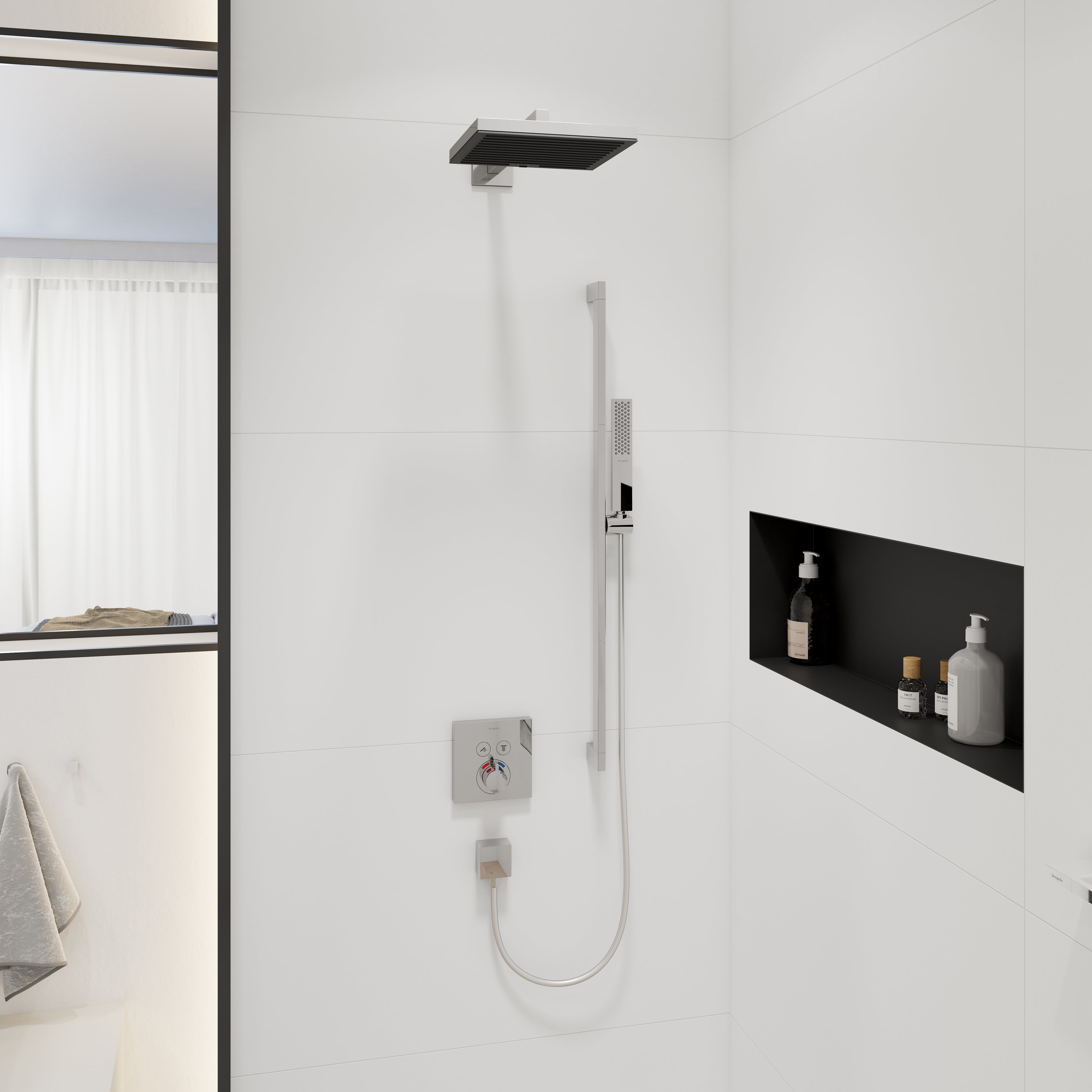 Chrome rectangular shower arm mounted horizontally to white bathroom wall above rainfall showerhead.