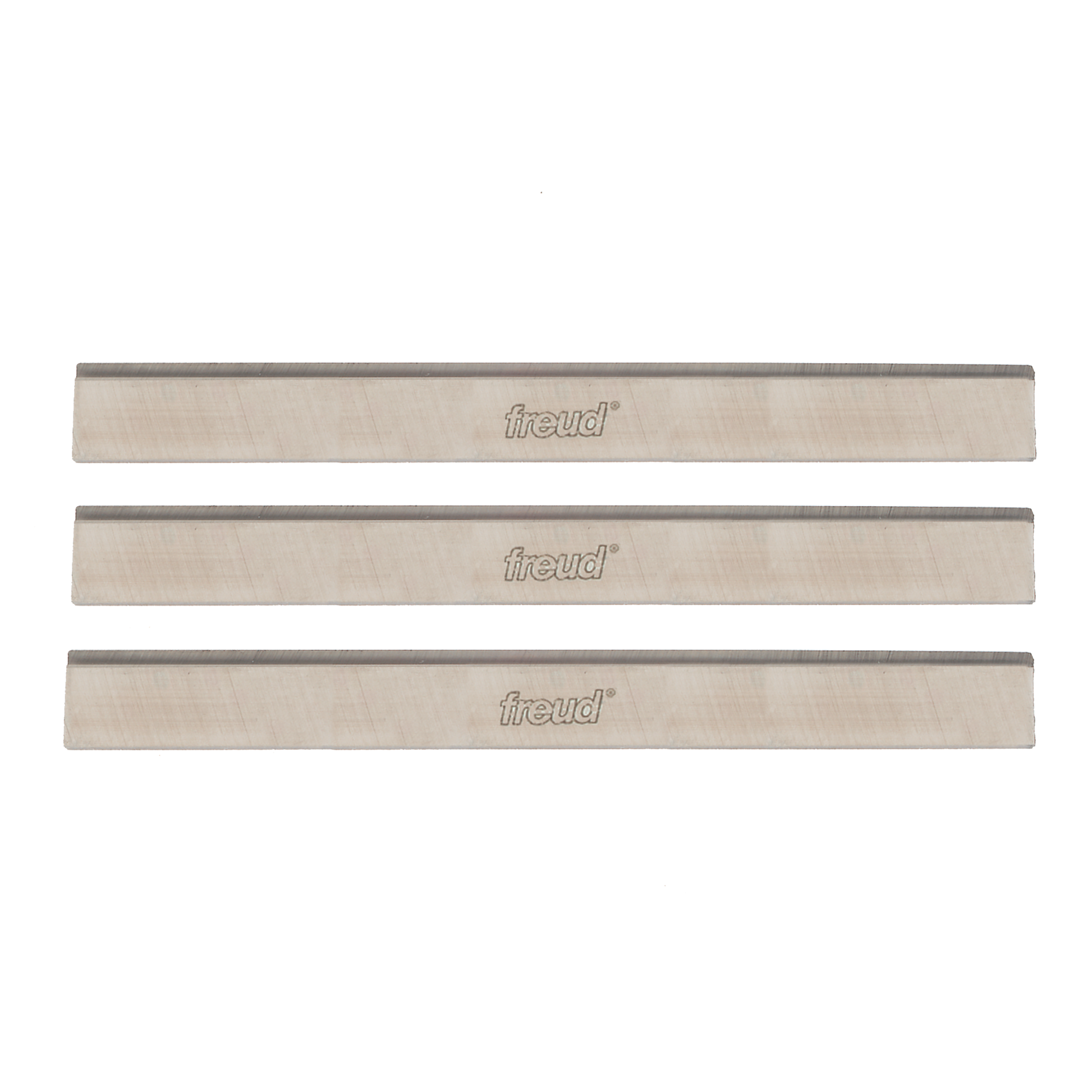 Three rectangular high speed steel planer knives with Freud branding and dark cutting edges.