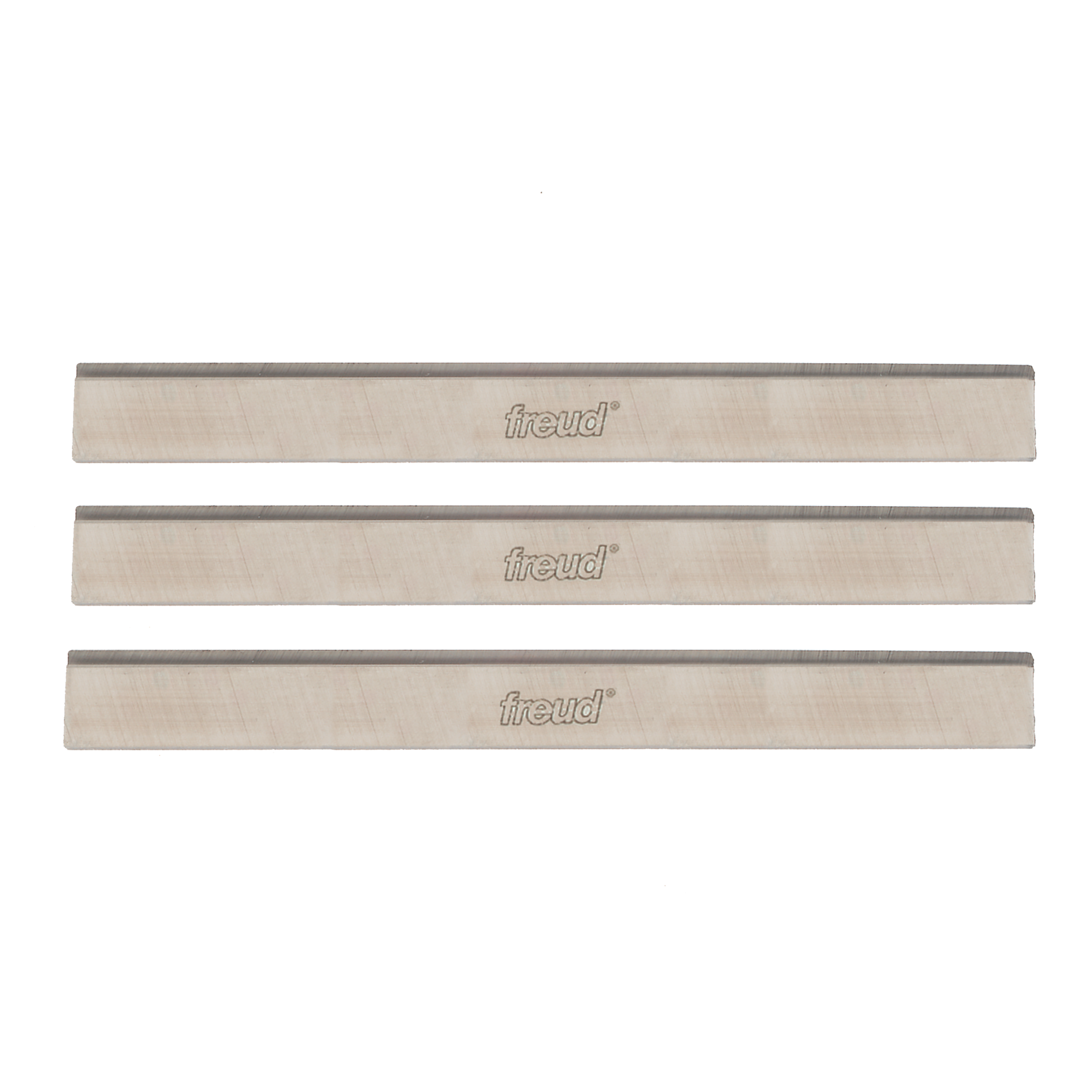 Three rectangular high speed steel planer knives with Freud branding and dark cutting edges.