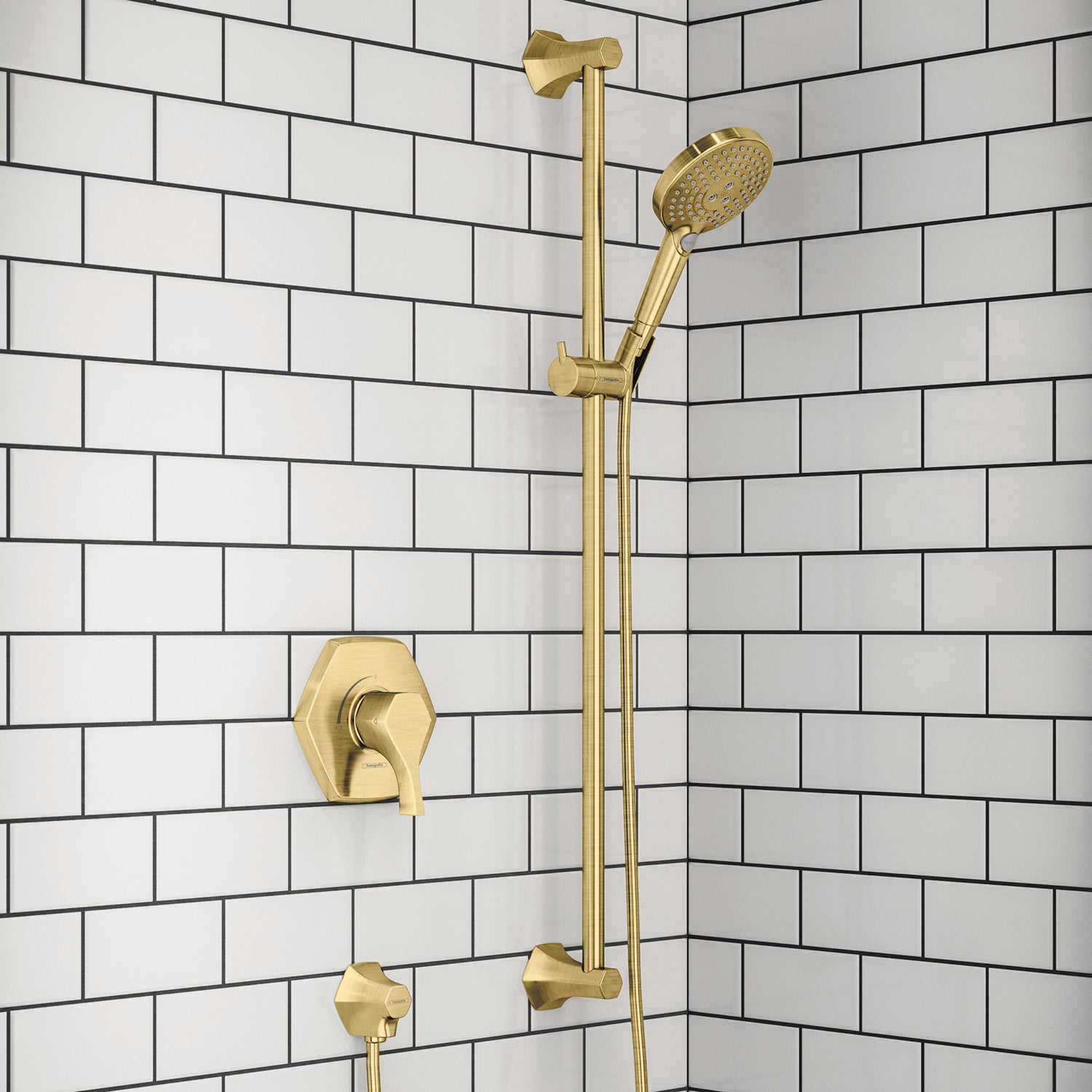 Brushed gold shower system with wall-mounted valve, vertical rail, handheld showerhead, and control handles on subway tile wa