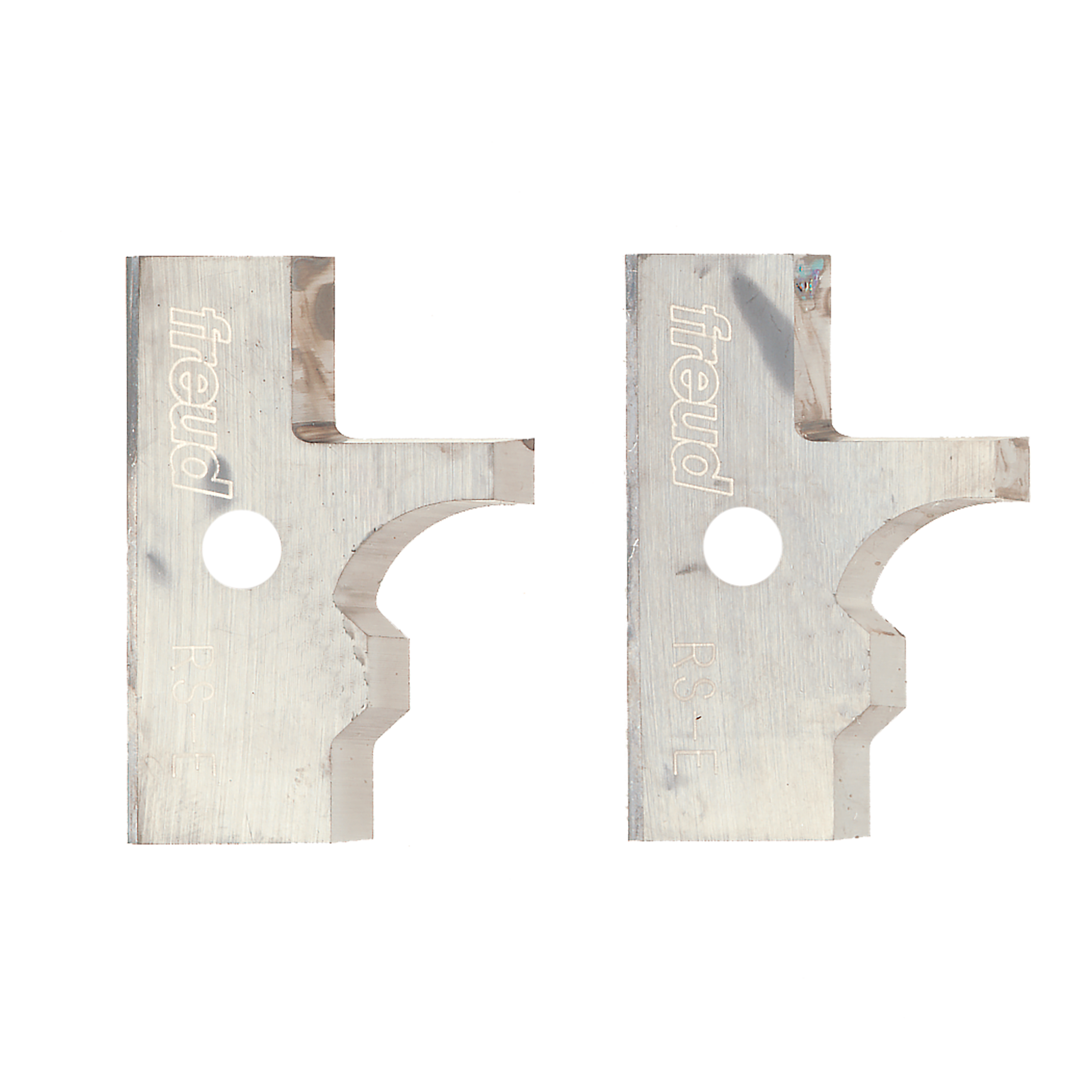 Two metal router knives with Freud branding, featuring matching curved and notched cutting profiles with circular mounting ho