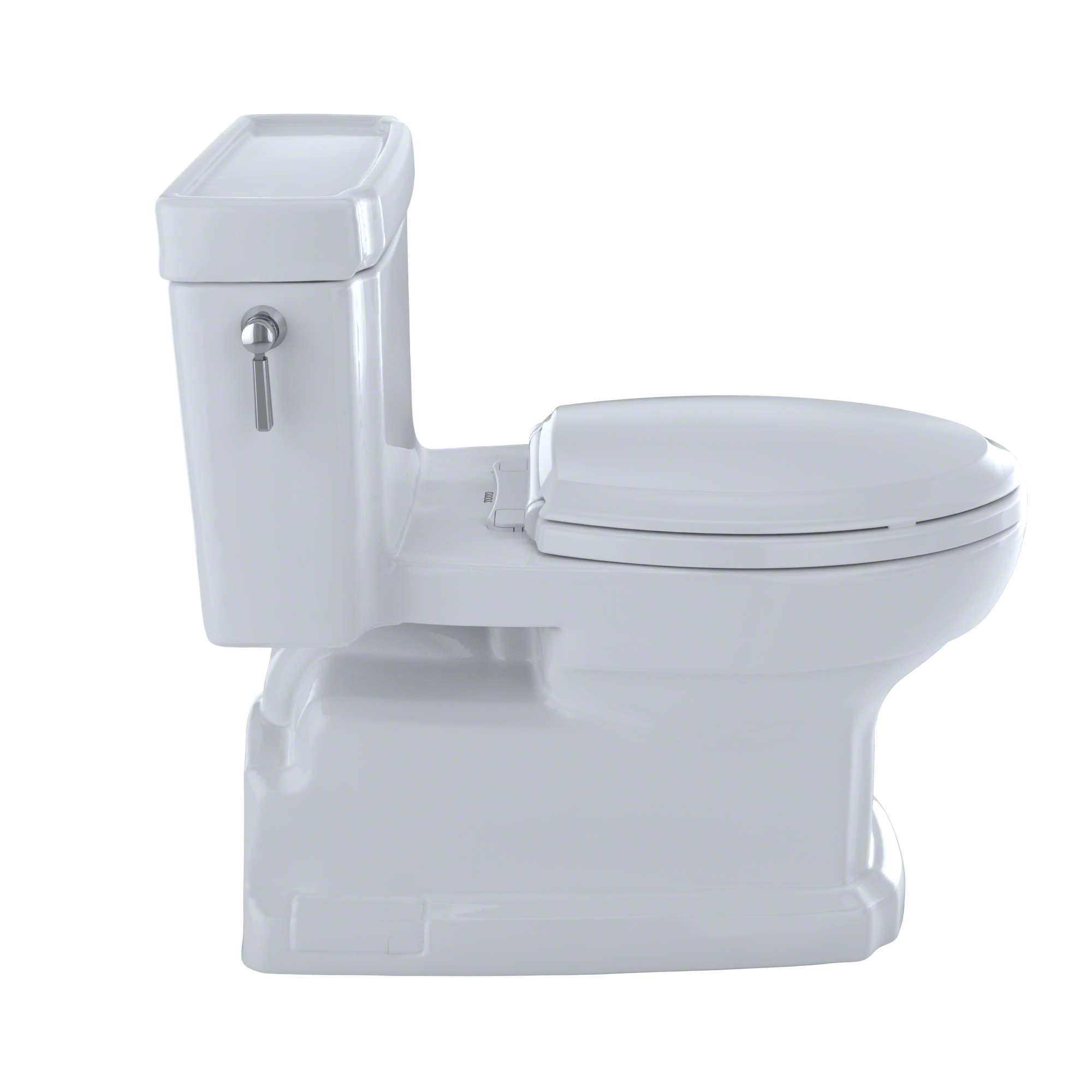 White elongated toilet with integrated tank, soft-close seat, and chrome handle lever on left side.