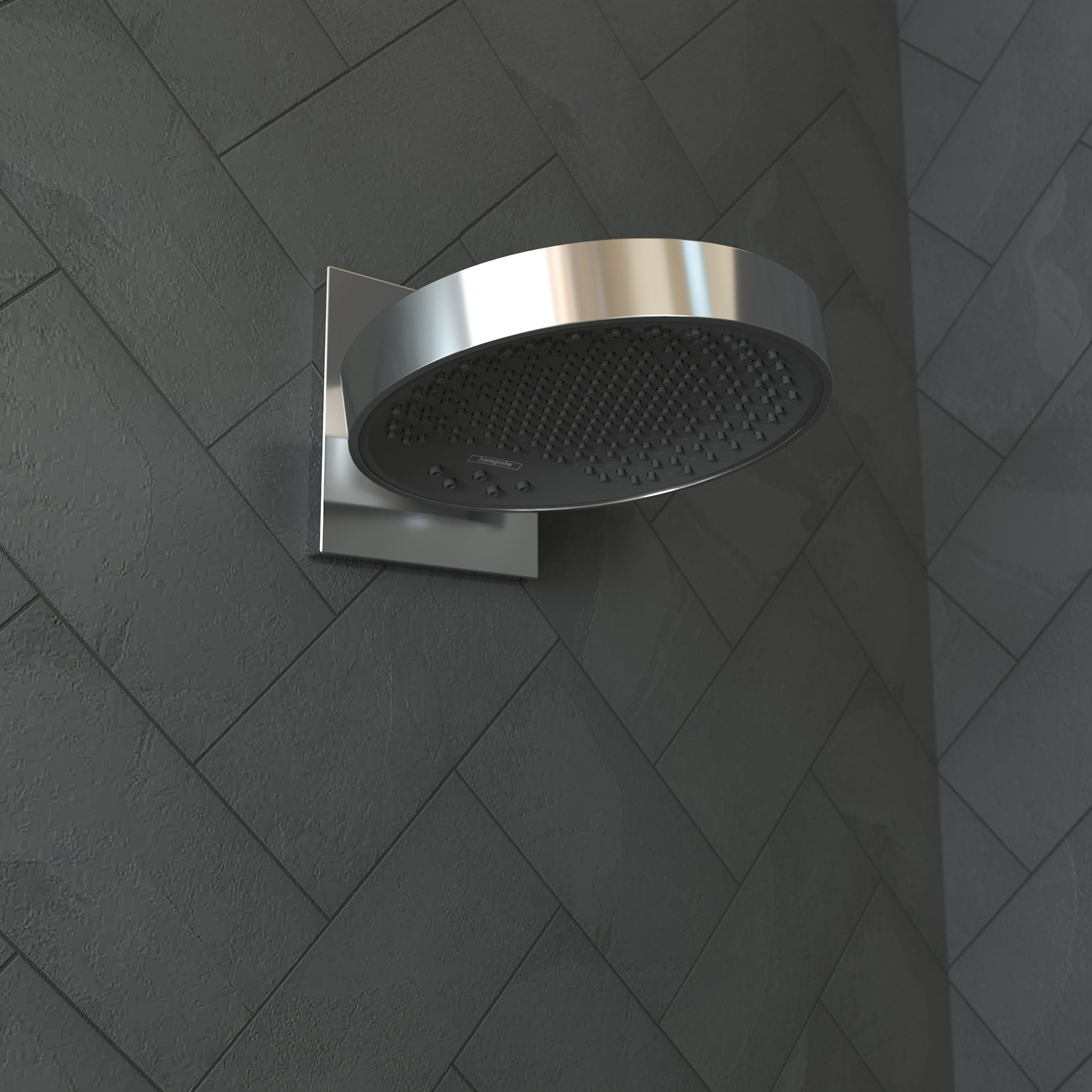 Chrome shower head with round black face and perforated nozzle pattern mounted on tiled wall with square trim plate.