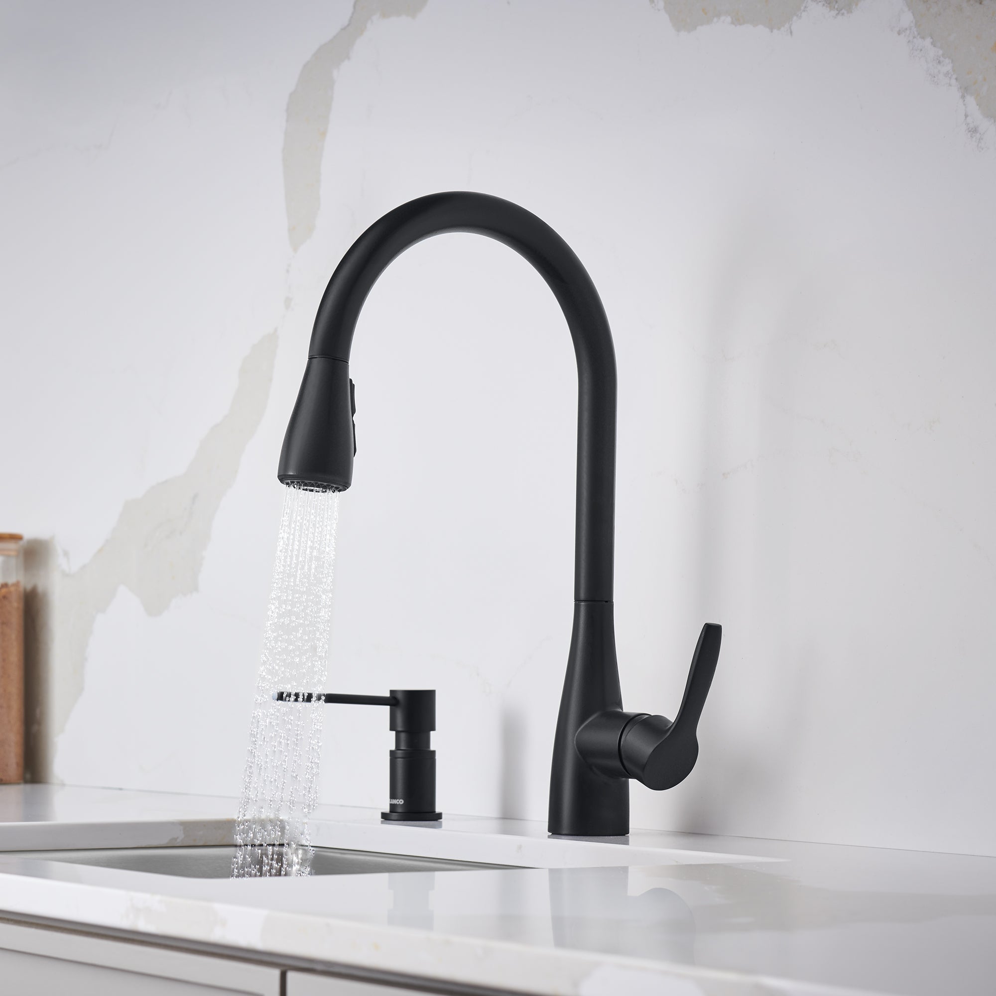 Matte black pull-down bar faucet with curved spout and side lever handle over white sink.