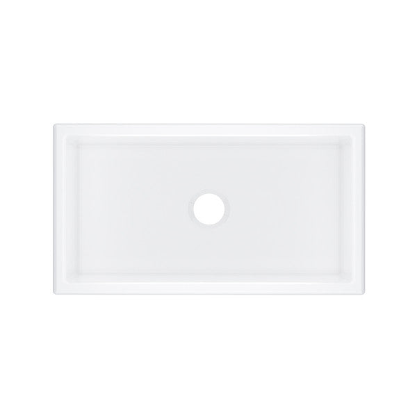 White fireclay single bowl undermount kitchen sink with faucet hole, rectangular shape with raised edges.