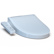 White elongated bidet seat with attached remote control on left side.