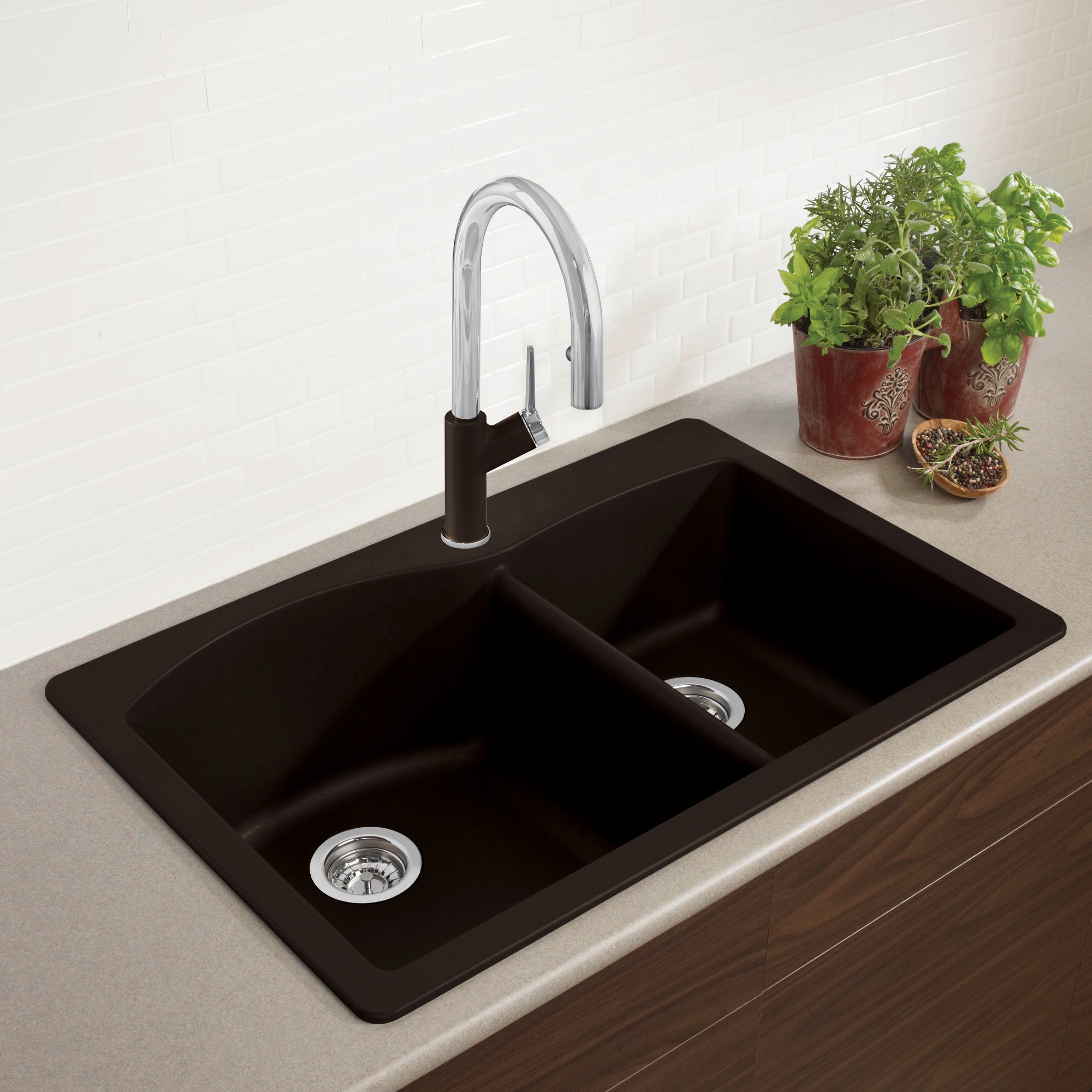 Cafe brown drop-in kitchen sink with two bowls, chrome faucet with black accent, and chrome drain strainers installed in coun