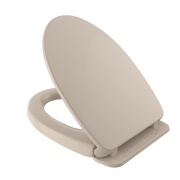 Bone-colored elongated toilet seat and lid with slow-close hinges mounted on white base.