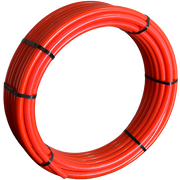 Red PEX tubing coiled with black straps securing the loops.