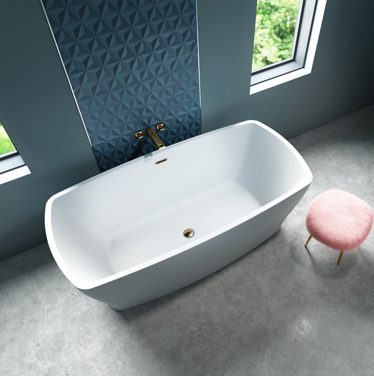 White rectangular freestanding bathtub with sloped sides and gold drain fixture in modern bathroom.