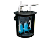 Black cylindrical pump basin with black lid containing two blue submersible pumps and white PVC discharge pipes.