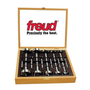 Freud Forstner bit set with 16 pieces in wooden case, ranging from 1/4" to 2-1/8" diameter.