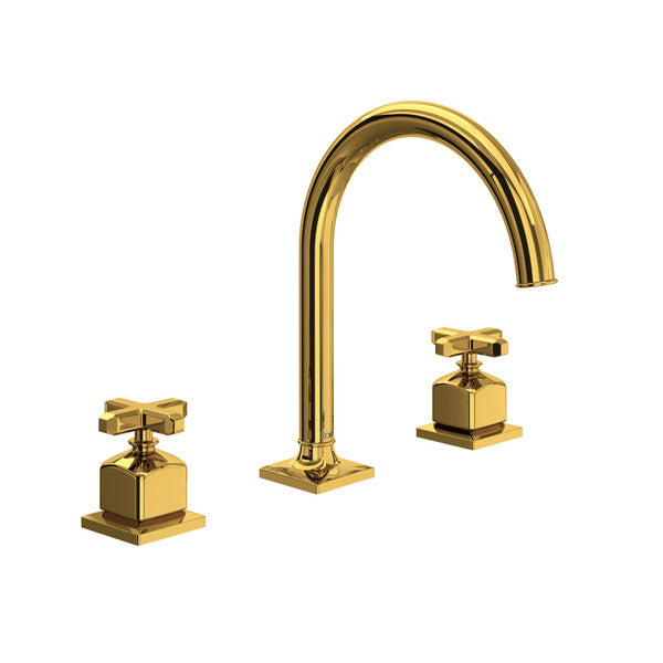 Unlacquered brass three-piece bathroom faucet with curved C-spout and cross handles.