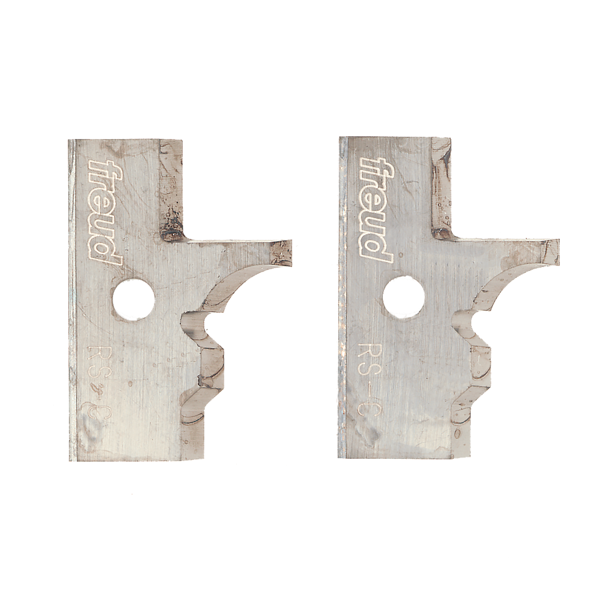 Pair of metal router knife blades with Freud branding and curved cutting edges for rail and stile profiling.